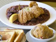 Fried catfish and red beans and rice with bread pudding at Mama's Kitchen in Vancouver.