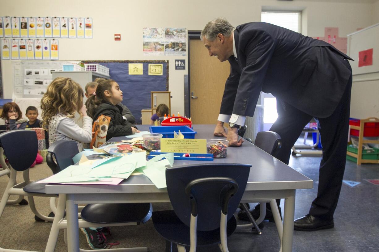 Gov. Jay Inslee meets kindergarten students Thursday at Washington Elementary School in Vancouver.