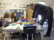 Gov. Jay Inslee meets kindergarten students Thursday at Washington Elementary School in Vancouver.