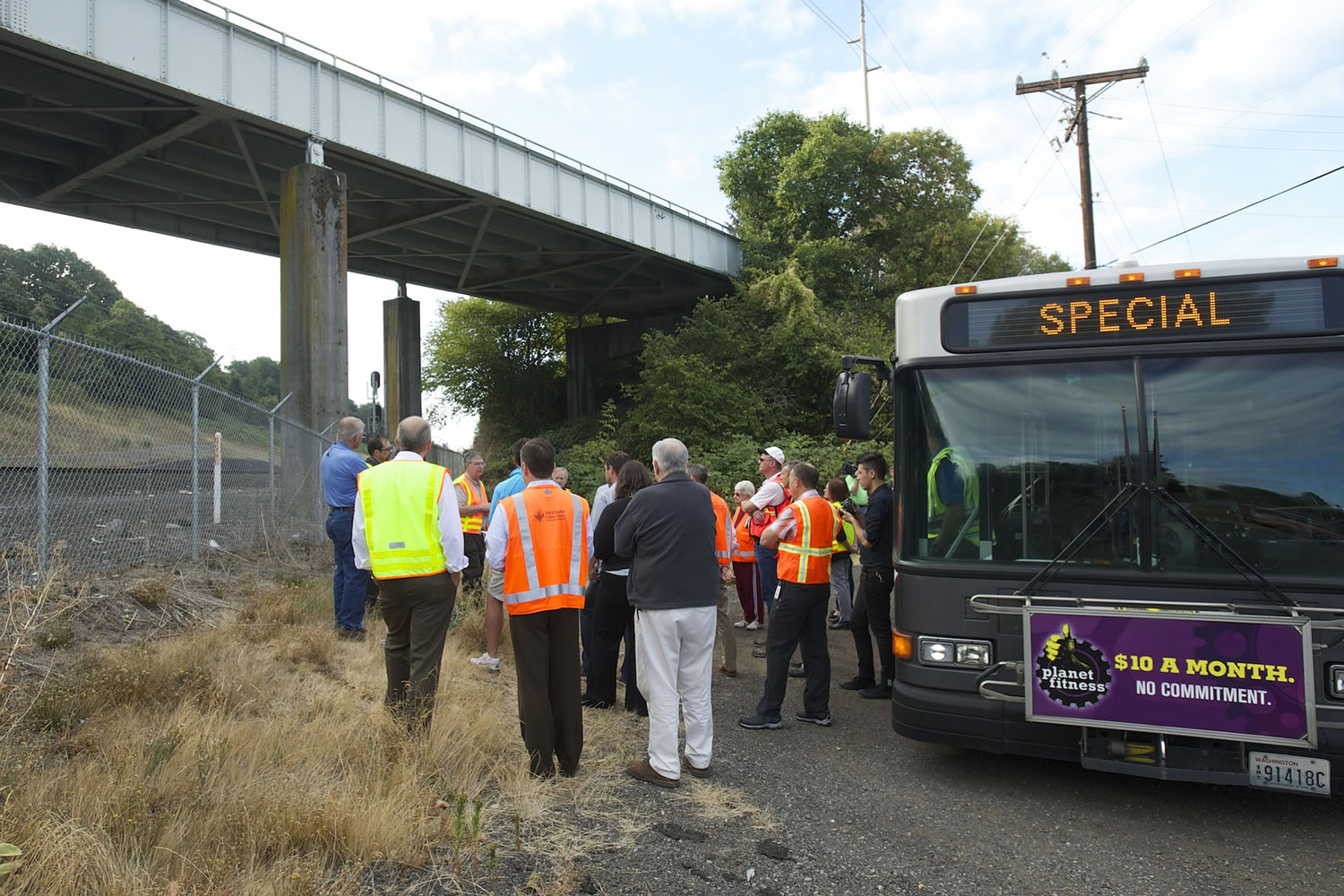 The Vancouver City Council and city employees take a look at the underside of the 1947 Fruit Valley Road bridge, which doesn't meet current seismic requirements, during a four-hour tour Friday of infrastructure needs.