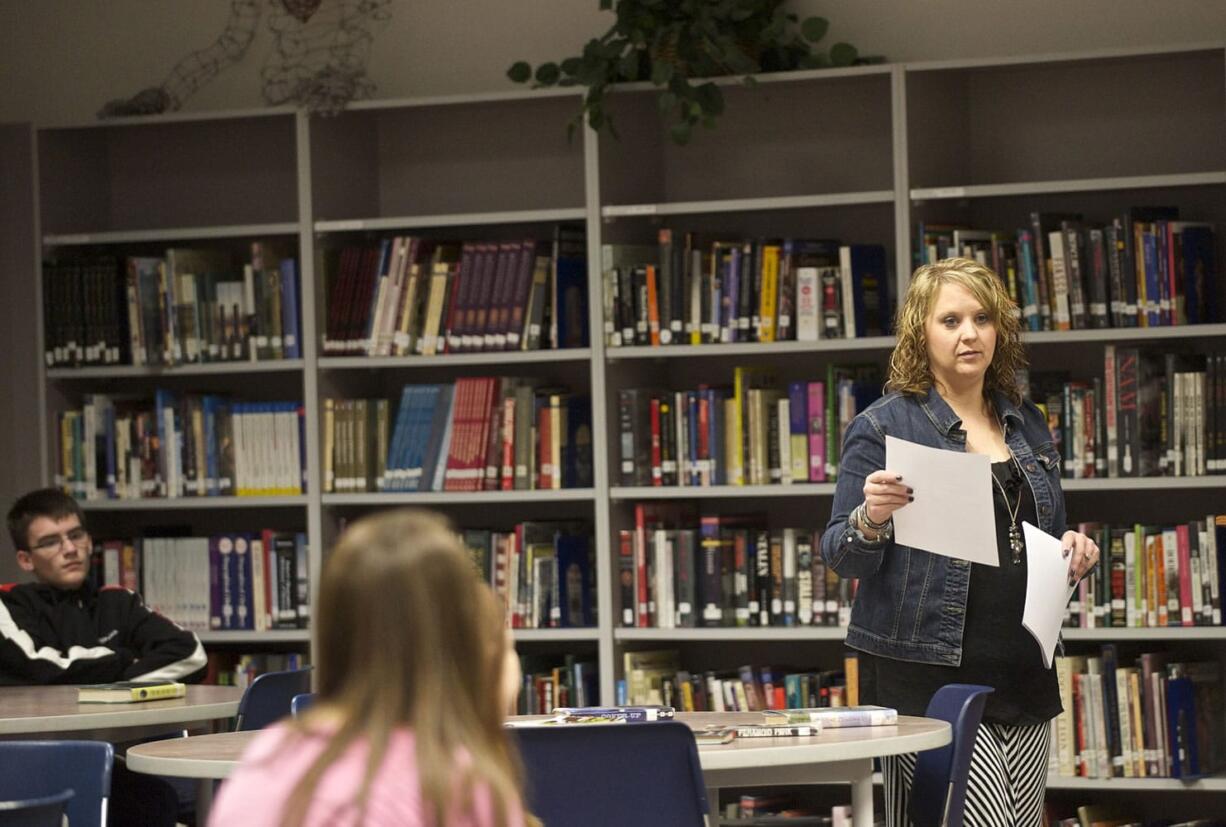 Skyview High School teacher-librarian Traci Chun works with students Tuesday. &quot;It's like any other profession,&quot; Chun said.