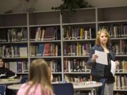 Skyview High School teacher-librarian Traci Chun works with students Tuesday. &quot;It's like any other profession,&quot; Chun said.