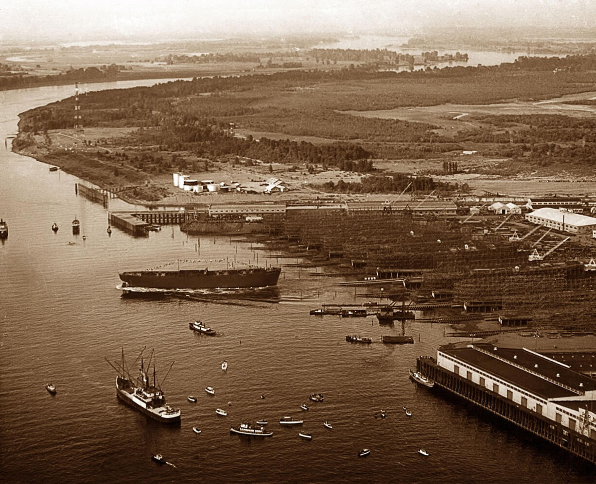 An aerial photo taken by Lev Richards of a ship launching at Kaiser's Oregon Shipbuilding Corp. shipyard on the Willamette River in Portland's St.