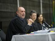 Washington State Court of Appeals Division II judges, from left, Rich Melnick, Jill Johanson and Lisa Worswick hear a local case at Hudson's Bay High School on Monday morning.