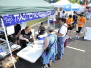 Eileen Granat serves kosher hot dogs at the Bagel On! Fun Fair on Sunday in the Barberton area.