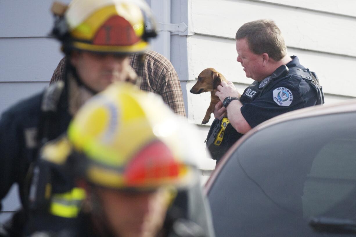 Firefighters respond to a house fire at 1105 E. 29th Street, on Friday.