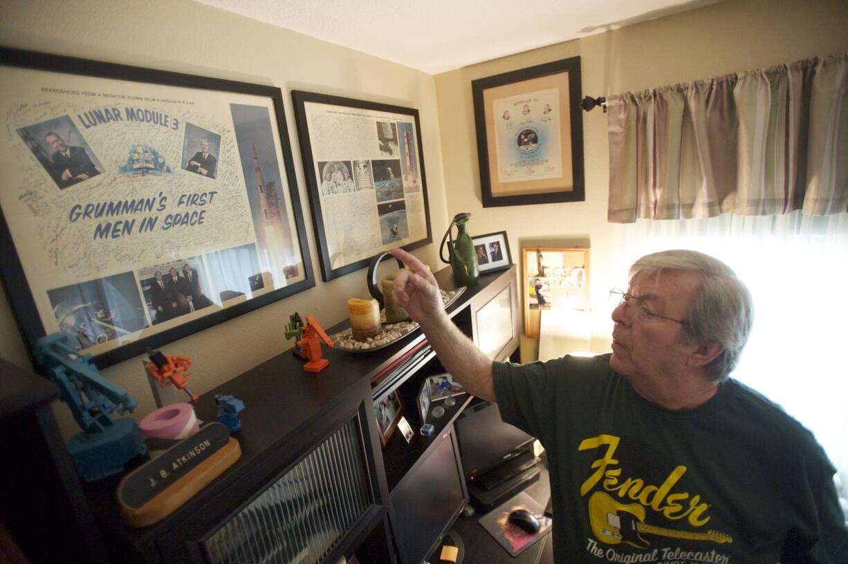 Jack Atkinson looks over the posters, photos and other mementoes from his three years working on the Apollo missions to the moon.