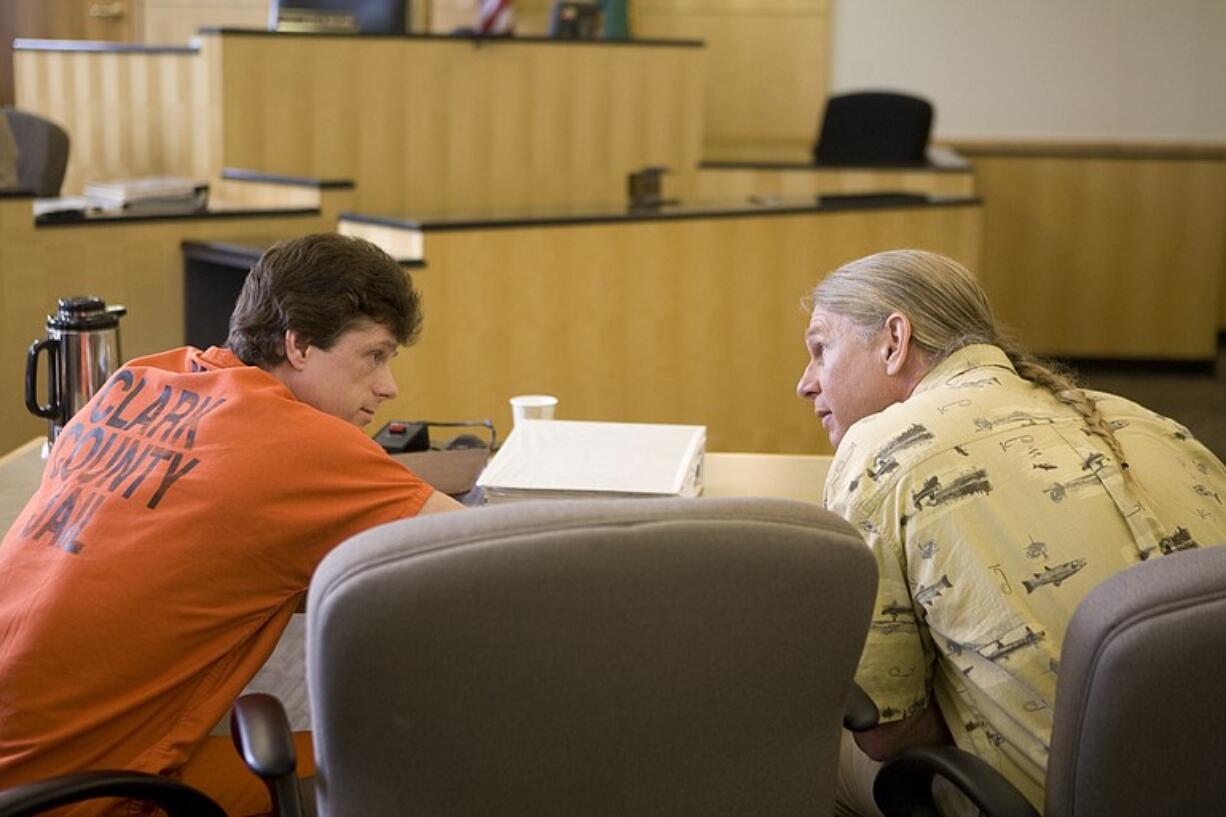 Alan Northrop, left, and Larry Davis talk to each other after hearing a Clark County judge decide to reverse their 1993 conviction of attacking a woman in La Center on the basis of new DNA testing unavailable at the time of the crime.