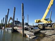 Dredging equipment sits ready to go Monday next to Lake River.