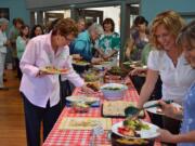 Vancouver's Dining for Women charitable group meets in 2012 to share food and raise money for the Children of Vietnam organization.