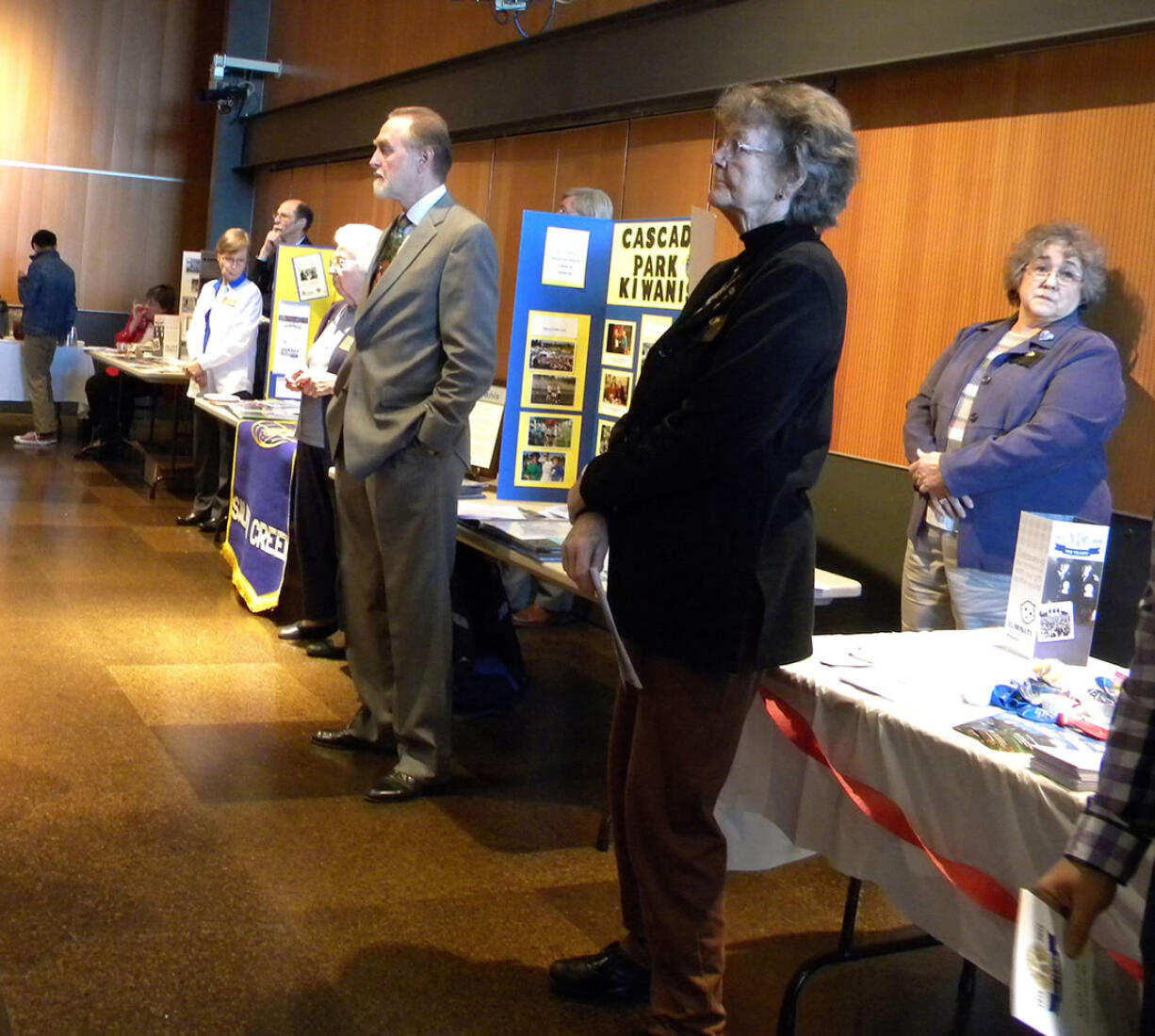 Members from the five local Kiwanis clubs watch the Kiwanis International 100th anniversary celebration at the Vancouver Community Library on Wednesday.