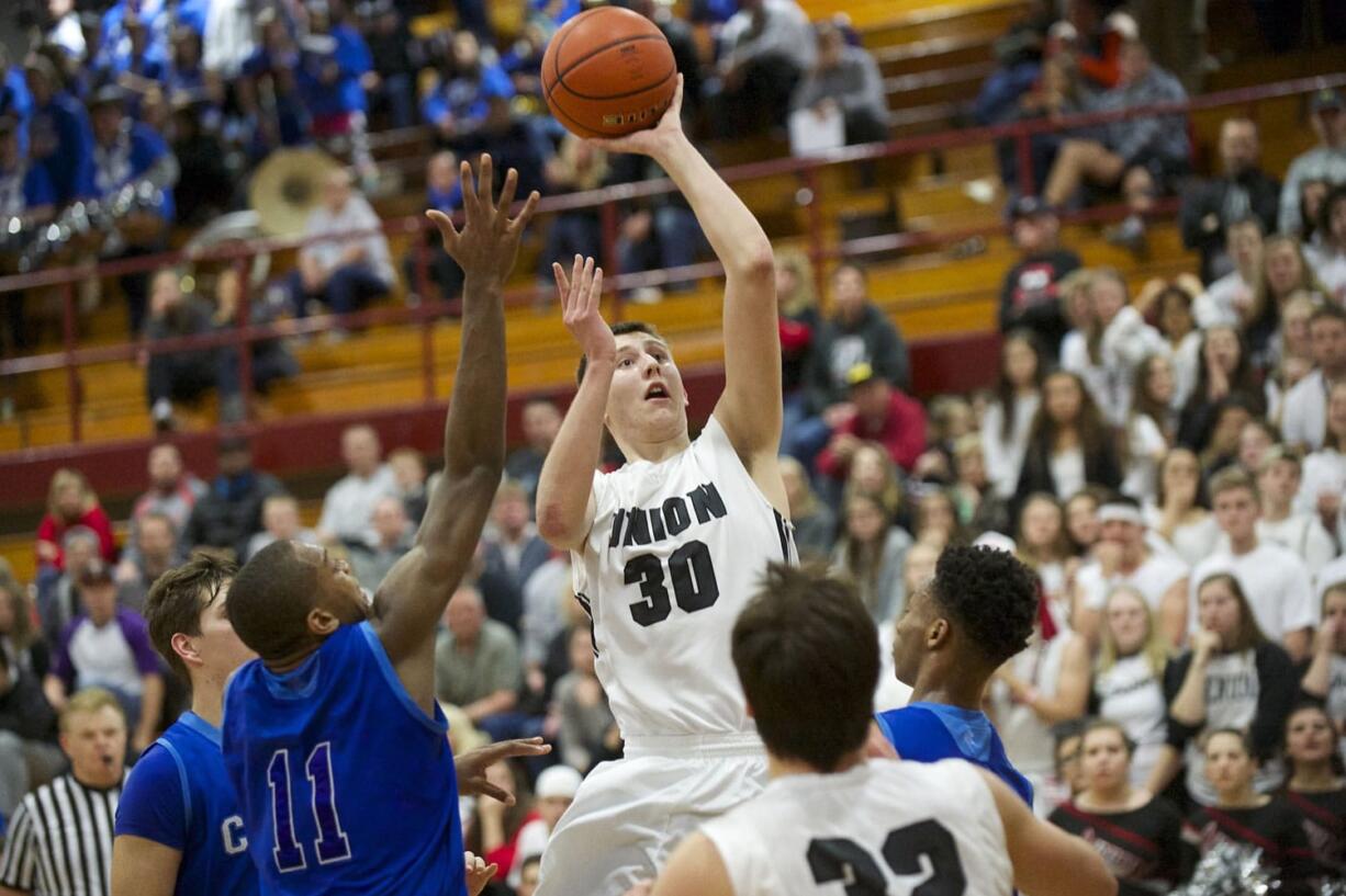 Cameron Cranston shoots as Union comes back in the fourth quarter to beat Curtis at the Hardwood Classic Regional Round, Friday, February 27, 2015.(