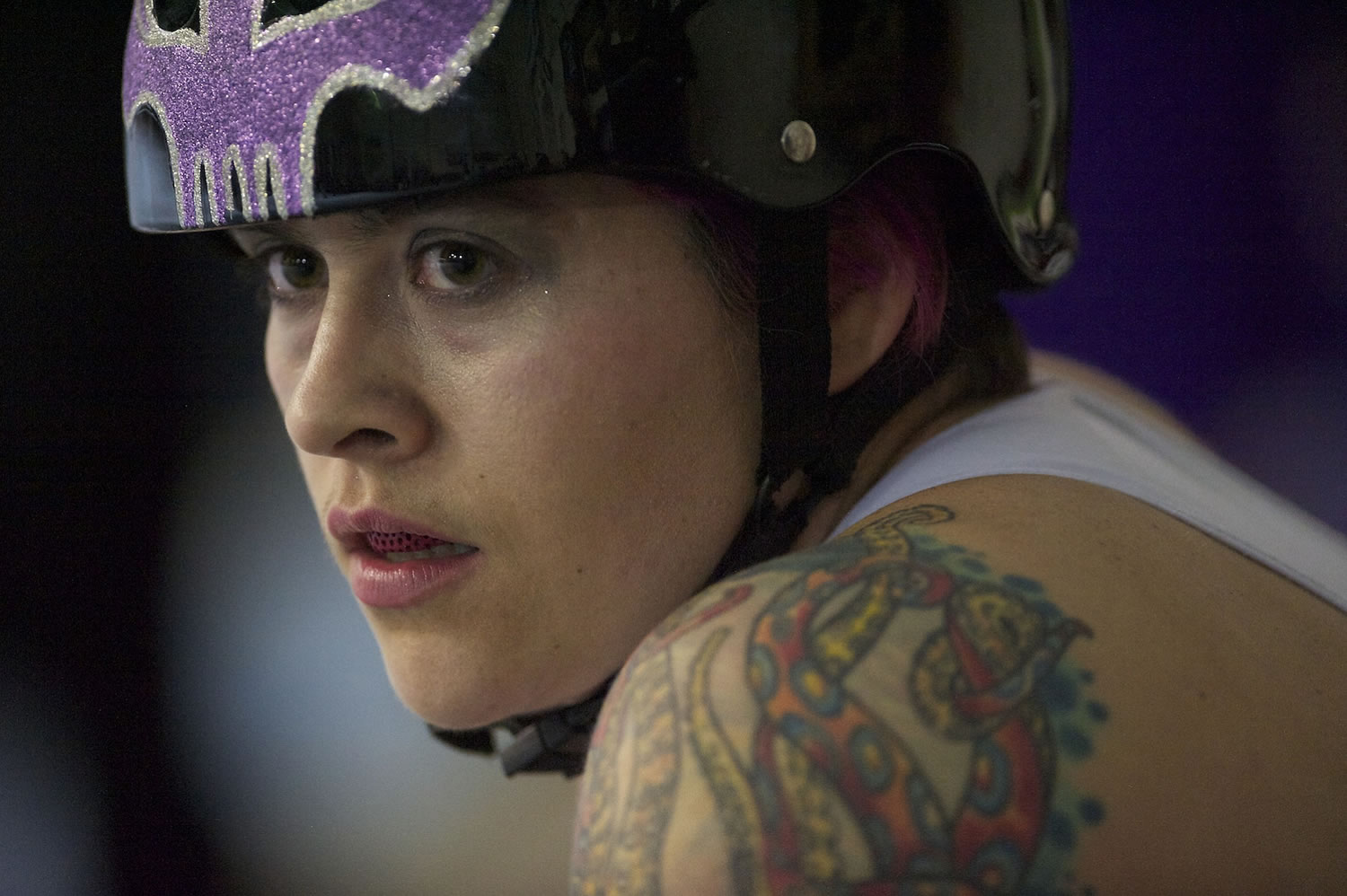 Wheels of Justice skater Carlee &quot;Scylla Devourer&quot; Wolcott rests on the bench during a roller derby bout at Oaks Park in Portland March 22.