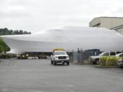 An unfinished 164-foot yacht was  moved from the Christensen Shipyard on Tuesday, and was to be placed on a barge for shipment to a Seattle shipyard for completion. A court-appointed receiver assigned to resolve financial disputes involving the Vancouver yacht builder wants to sell all or most of the company's assents to Tennessee businessman Henry Luken,  who owns 50 percent of the company.