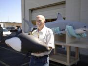 Jim Engelhardt of Show Time Exhibitions with a model of a Dall's porpoise that is part of a display for Point Reyes National Seashore in California.