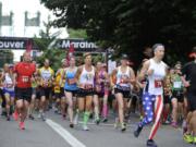 Runners start the Vancouver USA Marathon at Esther Short Park in downtown Vancouver, Wash., on Sunday June 21, 2015.