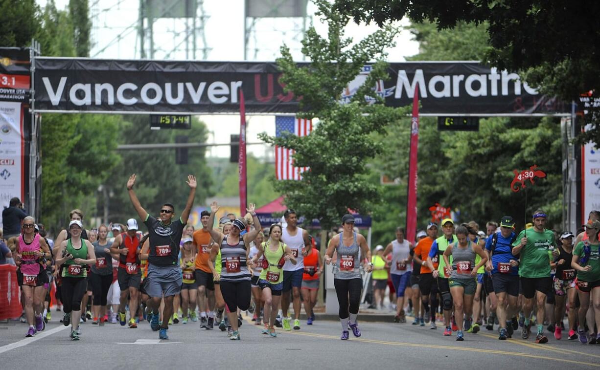 Runners get underway in the 2015 Vancouver USA Marathon on Sunday at Esther Short Park.