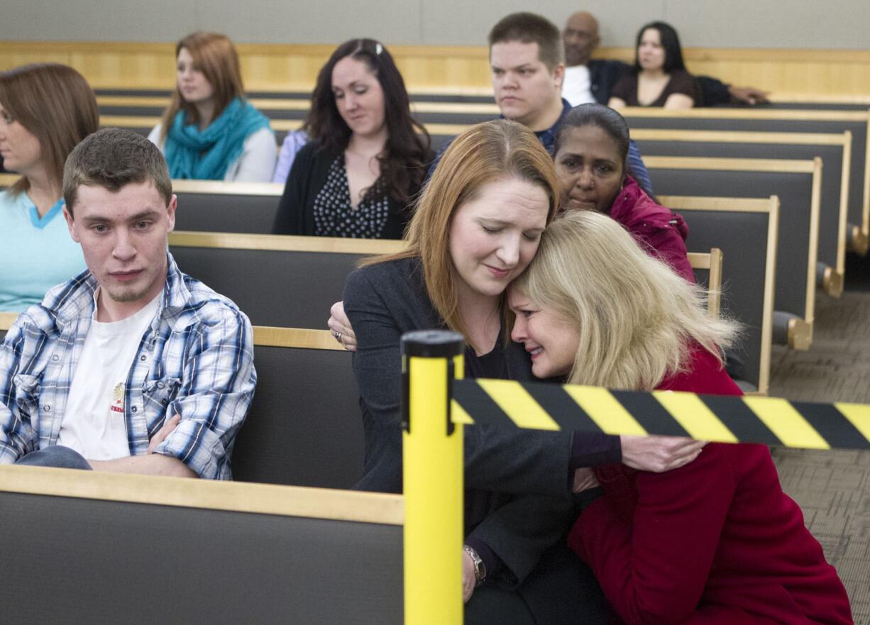 Evergreen High School drama teacher Stephanie McCrea, 35, is comforted by friend Kimberly Skach as she waits for her turn to be arraigned in court in Vancouver Wednesday February 11, 2015.