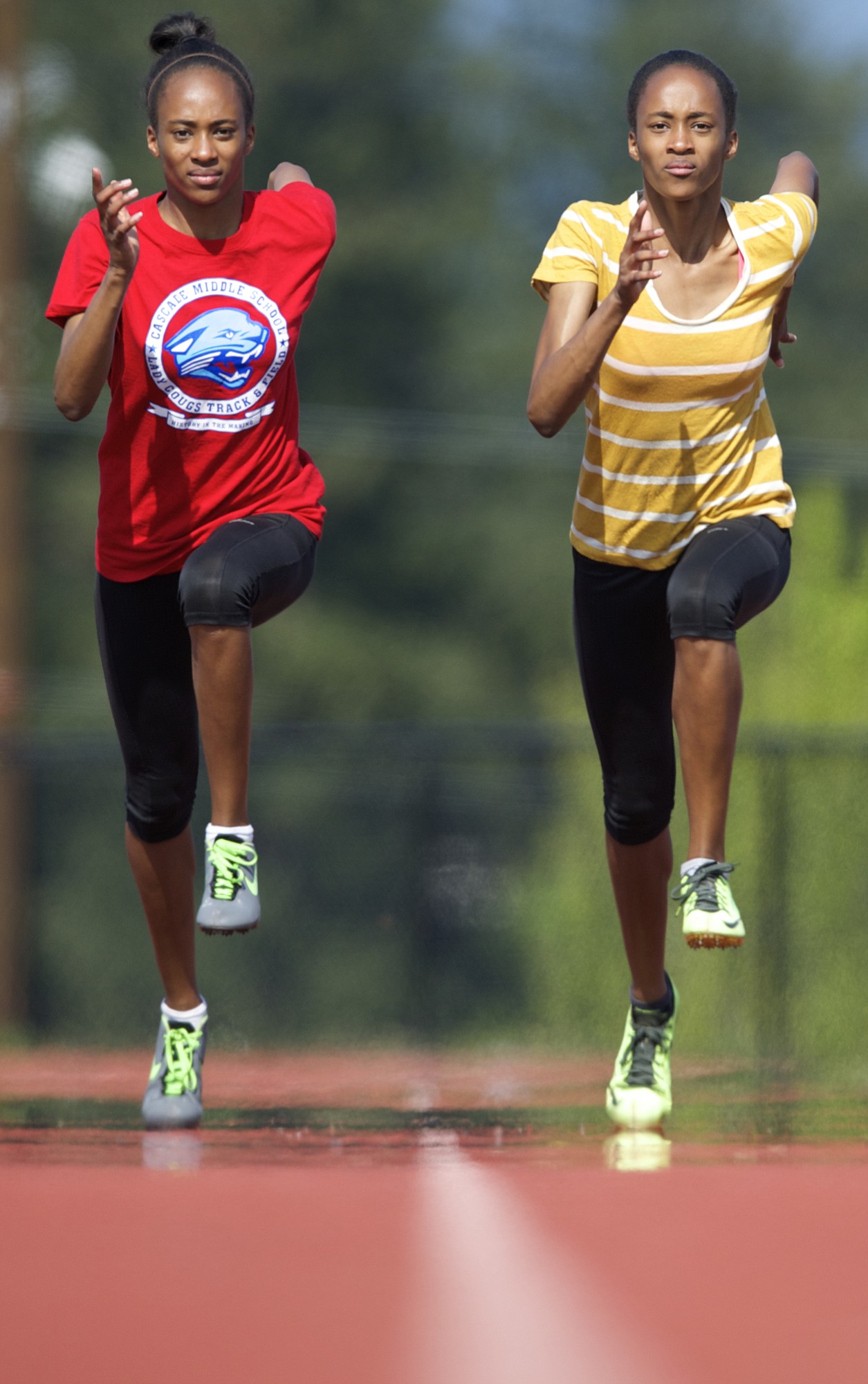 Union High School's identical twin sisters Dai'lyn, left, and Jai'lyn Merriweather shown, Thursday, April 30, 2015, are two of the top sprinters in the state.