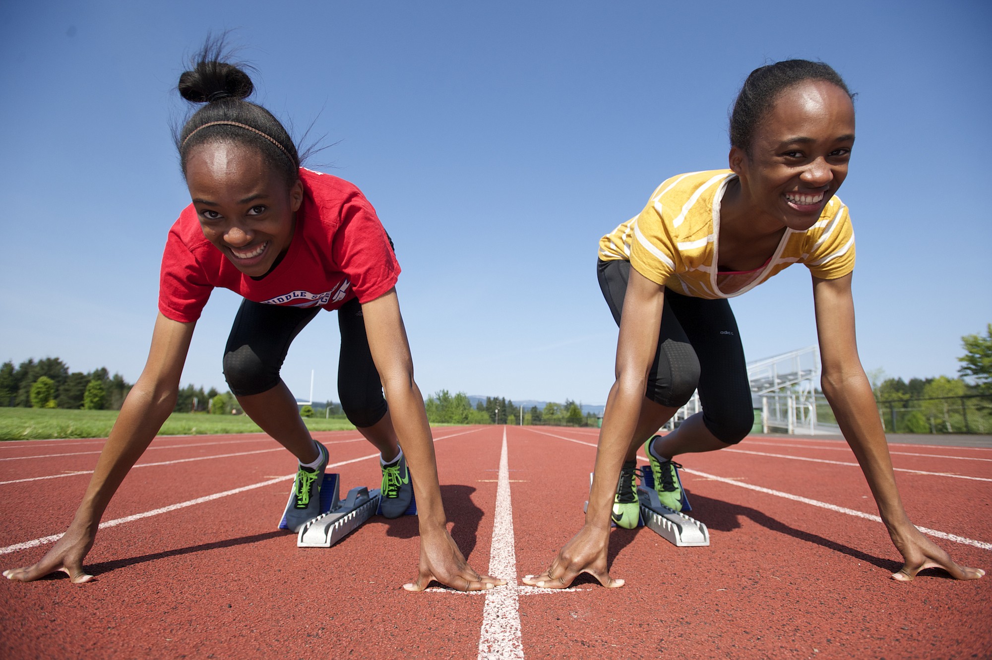 Union High School's identical twin sisters Dai'lyn, left, and Jai'lyn Merriweather shown, Thursday, April 30, 2015, are two of the top sprinters in the state.