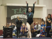 Nicole Moss of Heritage High School scores a 9.65 on the floor exercise, finishing second at the 4A state gymnastics championships in Tacoma on Saturday, Feb.