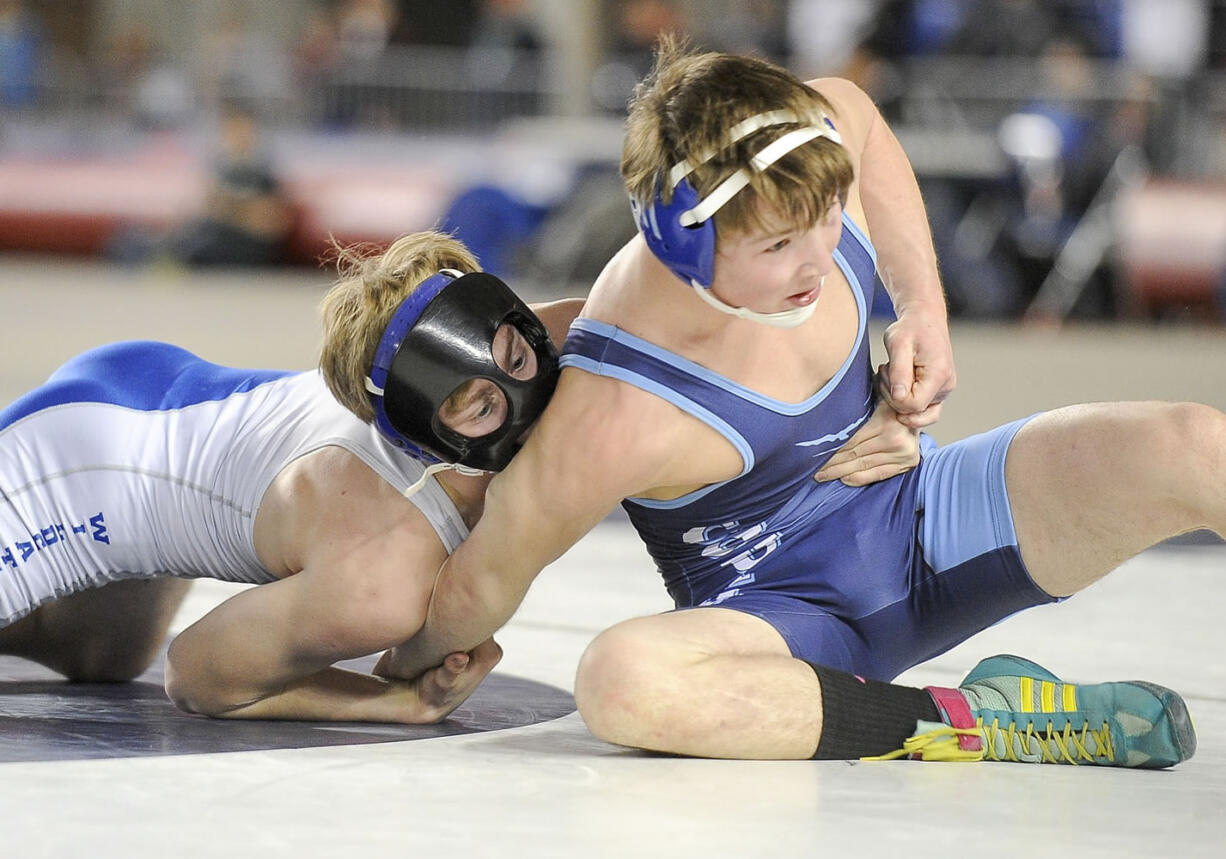 La Center's Derick Tollen, left, battles to control Chewelah's John Crise during their Class 1A state championship match Saturday at 126 pounds.