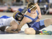 La Center's Derick Tollen, left, battles to control Chewelah's John Crise during their Class 1A state championship match Saturday at 126 pounds.