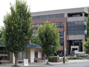 The small storefront building on East Mill Plain, in front of the Al Angelo Building at 400 E.