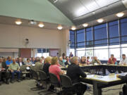 A crowd gathers Friday to listen to a pitch by FIGG Engineering Group to build an east county bridge over the Columbia River.