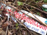 A political sign for Don Benton rests in a ditch next to Highway 99 in Hazel Dell on Thursday, March 27, 2014.