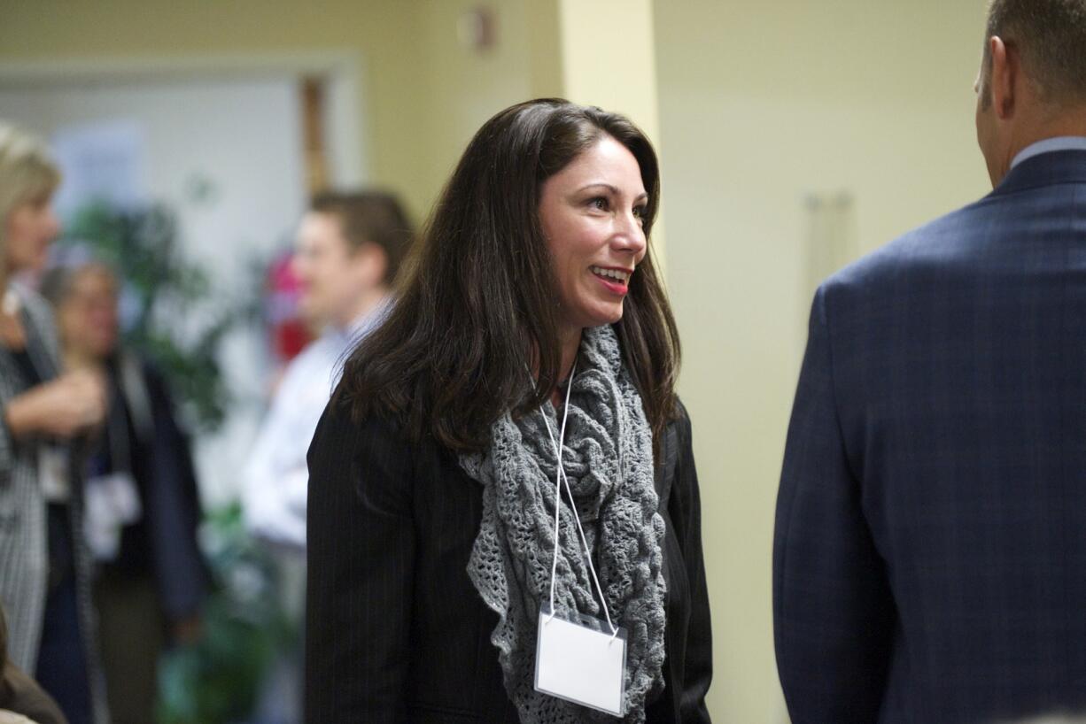 Alishia Topper chats with Steve Webb, superintendent of Vancouver Public Schools, at the Faith-Based &amp; School Gathering at Northside Baptist Church on Nov. 3.