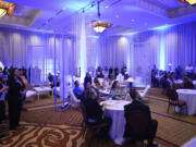 Employees gather Monday in the banquet room in celebration of the Hilton Vancouver Washington's 10-year anniversary.