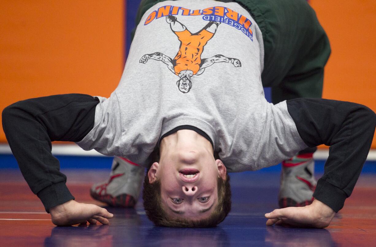 Ridgefield's Trevor Newburn looks to reverse a recent trend by scoring a win for small-school wrestlers at the Clark County Wrestling Championships this weekend.