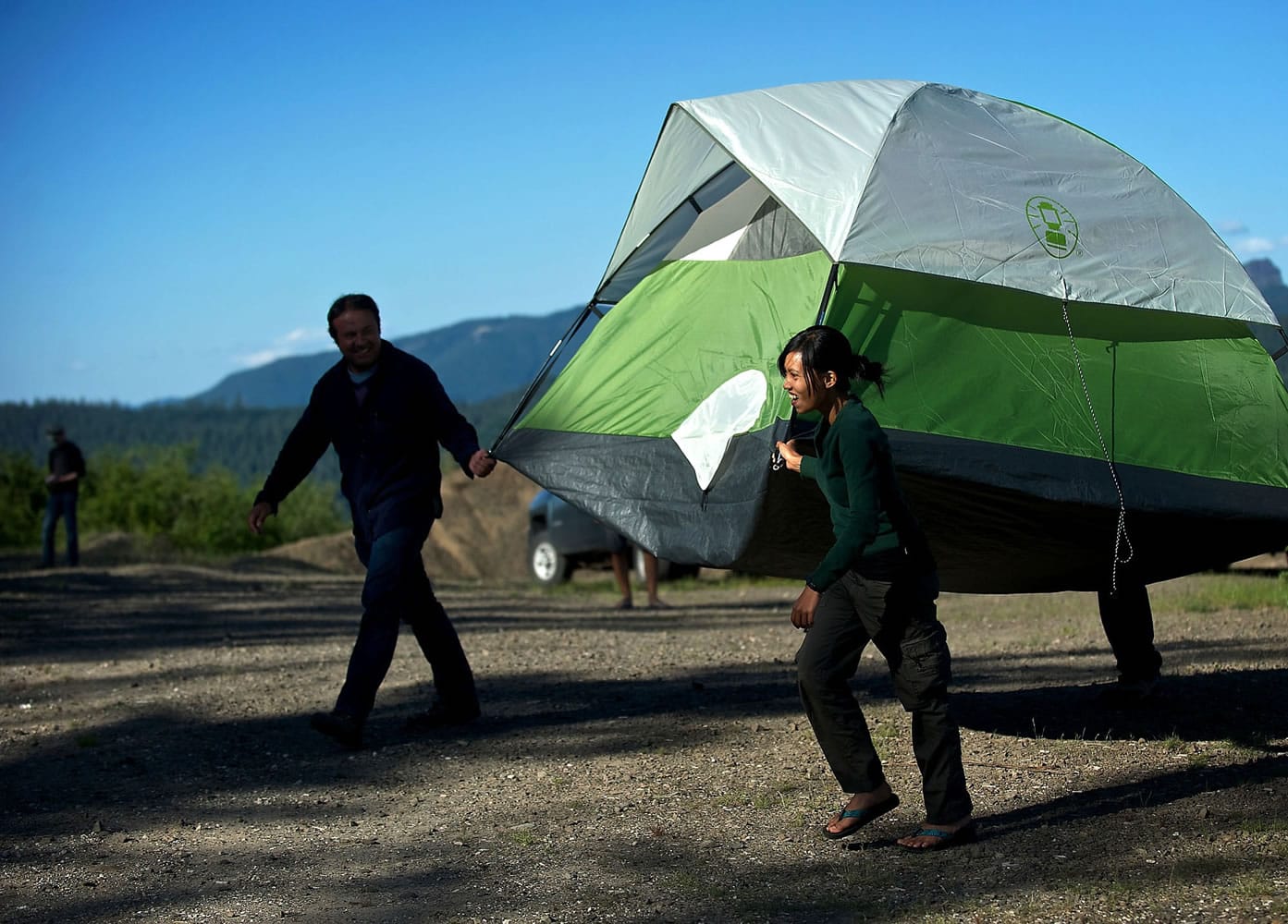 Visiting geologist from Indonesia Syegi Kunrat carries a tent with colleagues at the Mount St. Helens Institute on Saturday July 13, 2013. The USGS is hosting group of geologists from the international community to study volcanoes in the United States. The group will spend several days in the field complemented by several days in the classroom at the Cascade Volcano Observatory in Vancouver. They spent six weeks on the Big Island in Hawaii studying the Kilauea volcano before arriving in Washington State.