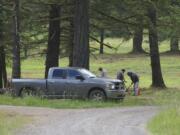 Cleanup crews search for buried munitions at Camp Bonneville on Thursday.