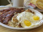 Corned beef hash, hash browns and sunny-side-up eggs with an English muffin and coffee at Joe Brown's Cafe.