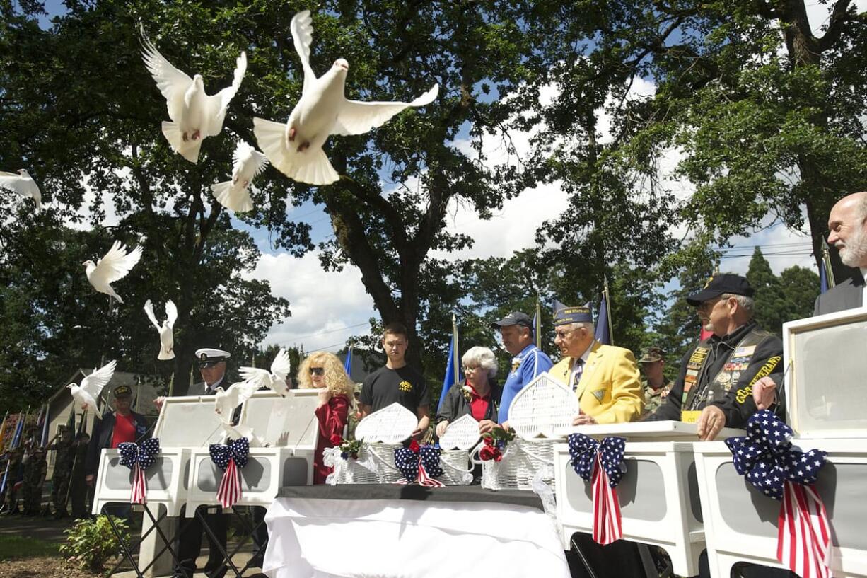 White doves are released May 26, 2014 in memory of those who died in the line of duty, including Air Force Capt. Chris Stover, during an observance at the Clark County Veterans War Memorial. Stover died Jan. 7 when his helicopter crashed in England during training.