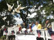 White doves are released May 26, 2014 in memory of those who died in the line of duty, including Air Force Capt. Chris Stover, during an observance at the Clark County Veterans War Memorial. Stover died Jan. 7 when his helicopter crashed in England during training.