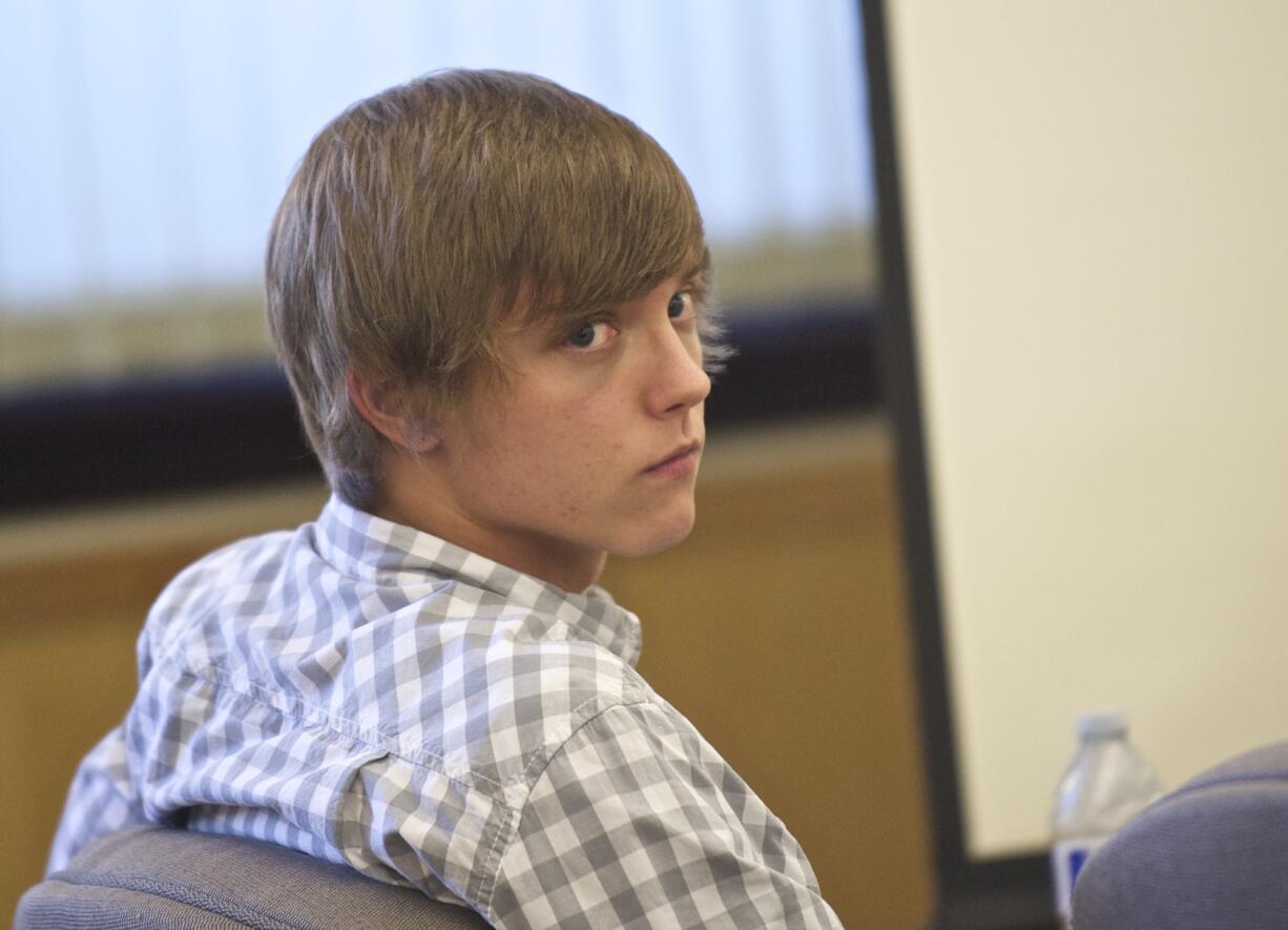 Ryan Matison, 22, of Battle Ground listens to opening statements Monday during his trial in Clark County Superior Court Judge Suzan Clark's courtroom.