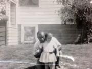 Marie Bruin kept this childhood photo of herself and her adoptive father on her desk at work.