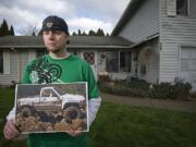 Darus Gieseman holds a photograph of his 1986 Toyota 4X4 truck, which was stolen from the backyard of his family's home earlier this month.