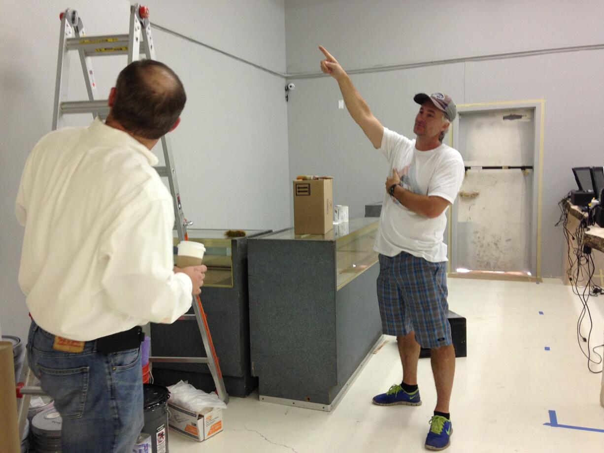 Brian Stroh, right, of CannaMan Farms, looks at New Vansterdam's checkout area on a visit with Brian Budz, one of the owners. The store plans to open at 8 a.m.