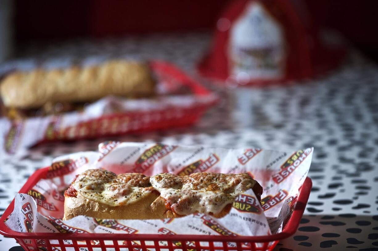 The Firehouse Meatball Sub, foreground, and the Smokehouse Beef