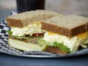 An egg salad and cheddar cheese sandwich is served May 29 at City Sandwich in downtown Vancouver.