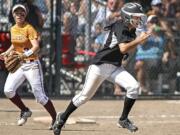 Woodland's Sidra Malik takes off after the throw flew over White River first baseman Megan Vandegrift. Between the bunt and the following overthrows, Malik ended up scoring on the play in their 2A semifinal game at Selah.