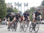 Cyclists pedal up Columbia Street on Sunday during the Vancouver Courthouse Criterium, an eight-corner circuit road course through the heart of the city.