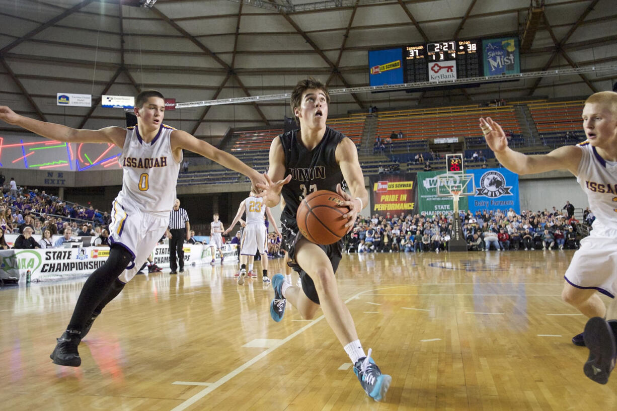 Riley Hawken makes a move to the basket for two of his game-high 26 points as Union beats Issaquah 63-55 at the 2015 WIAA Hardwood Classic 4A Boys tournament at the Tacoma Dome, on Thursday, March 5, 2015.