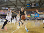 Riley Hawken makes a move to the basket for two of his game-high 26 points as Union beats Issaquah 63-55 at the 2015 WIAA Hardwood Classic 4A Boys tournament at the Tacoma Dome, on Thursday, March 5, 2015.