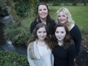 Lilliane Grahek, front left, with her sisters, Genevieve Grahek, front right, and Karlene Hamar, back left, and her mom, Kerin Clark Severson, at their Vancouver home.