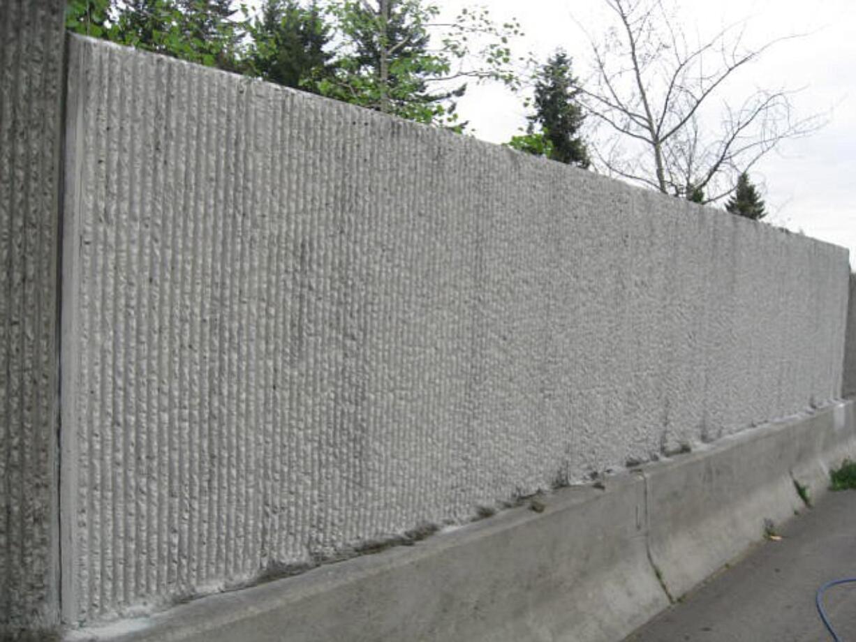 A group of local volunteers charged with removing graffiti on state highways often respond quickly to paint over targeted locations, including this newly cleaned spot along state Highway 500 in Vancouver.